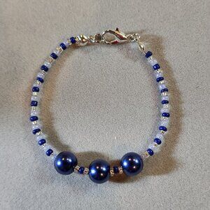 Beautiful navy blue, light blue and white beaded bracelet